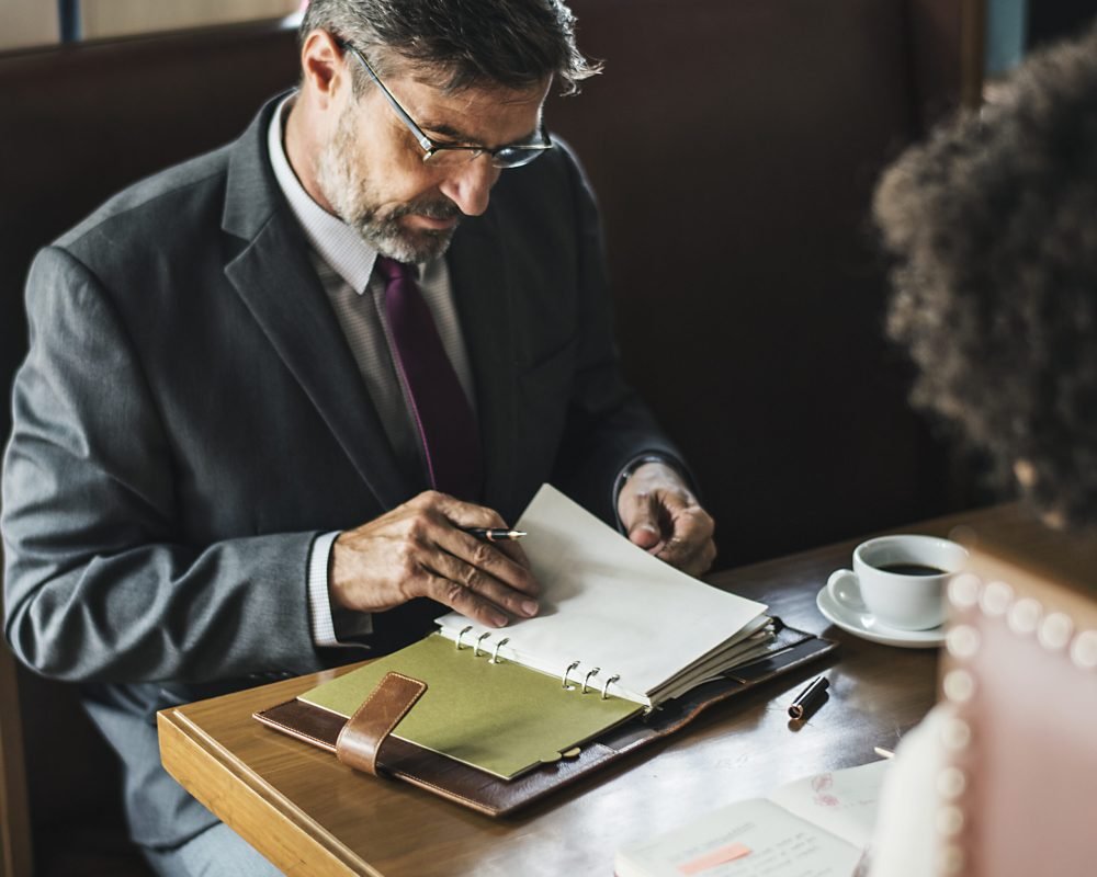 Business people discussing in the cafe