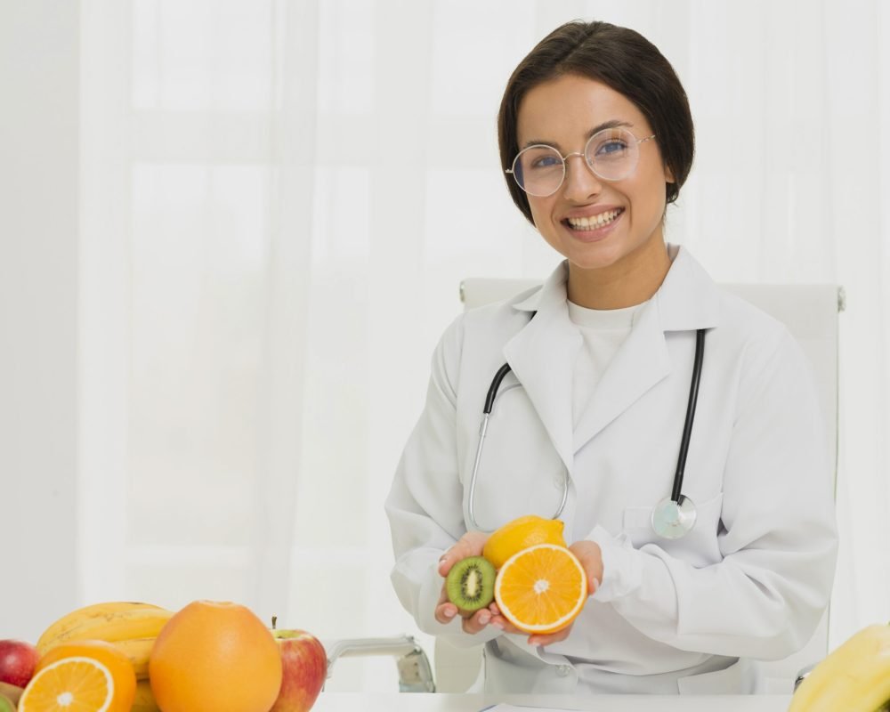 medium-shot-happy-doctor-with-orange-kiwi